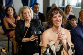 Guests react emotionally during a wedding ceremony at Hotel William Gray in Montreal. The photo captures the moment, highlighting the ceremony's emotion.